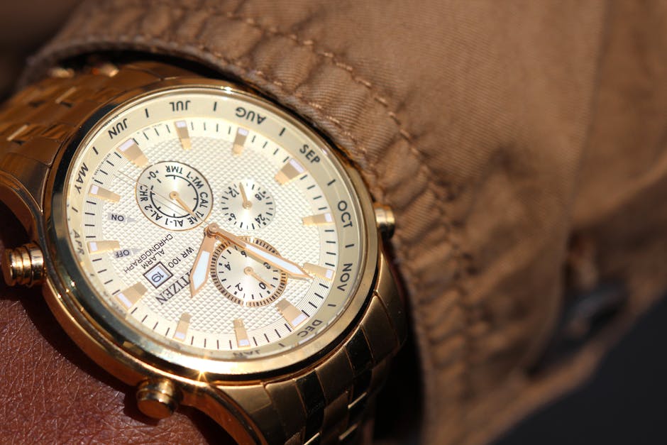 Close-up of a sophisticated gold wristwatch with functional chronograph and date display.